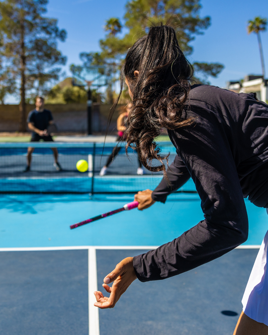 Pickleball players competing in an exciting tournament match