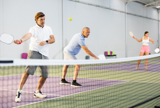 Players competing in a vibrant pickleball tournament