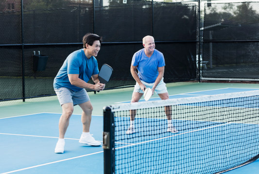 Group pickleball coaching session with focused training and tips