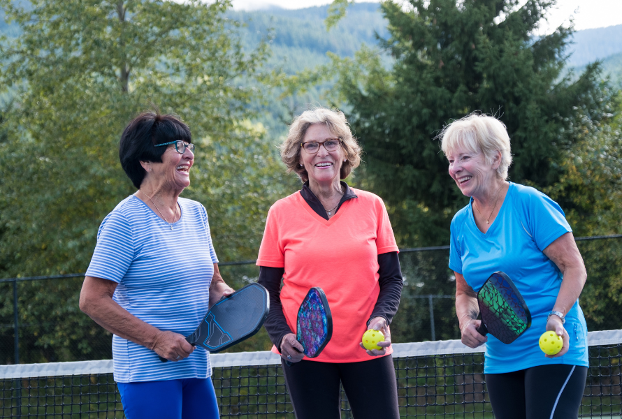 Pickleball players celebrating community spirit on court