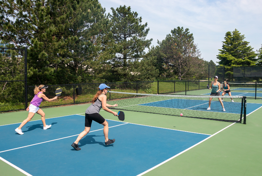 Intermediate pickleball player mastering footwork and shot placement on the court