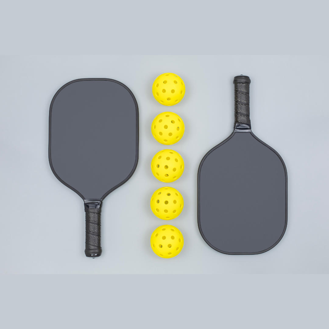 Modern and vintage pickleball paddles and balls displayed side by side