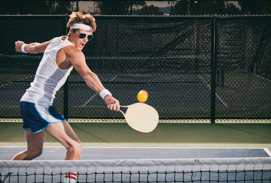 Pickleball player performing agility drills on cour